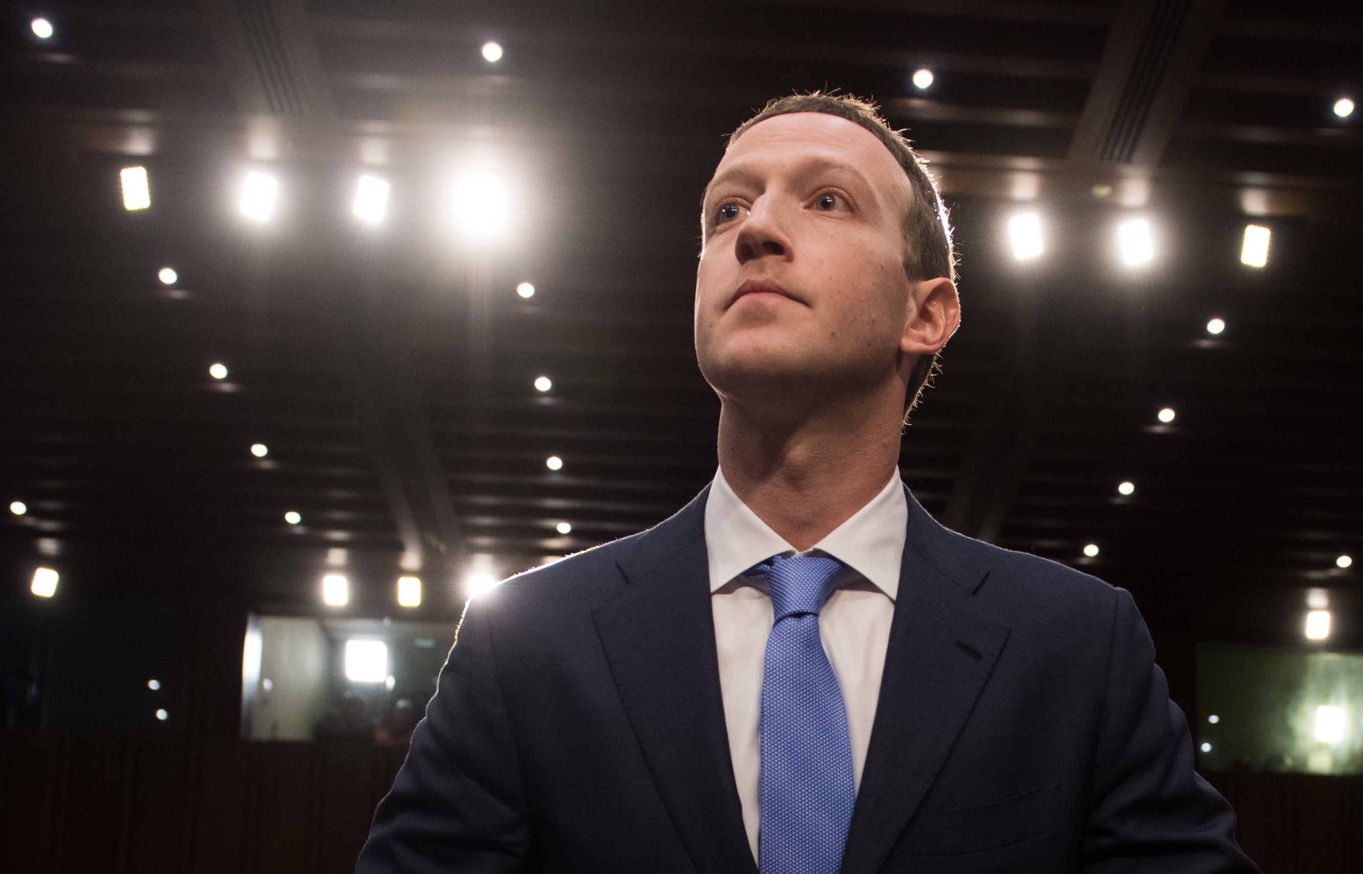 Facebook founder and CEO Mark Zuckerberg arrives to testify following a break during a Senate Commerce, Science and Transportation Committee and Senate Judiciary Committee joint hearing about Facebook on Capitol Hill in Washington, DC.