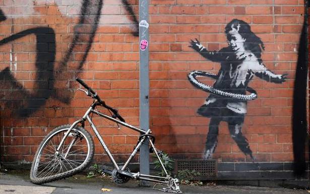 British artist Banksy claims hula-hooping girl street art